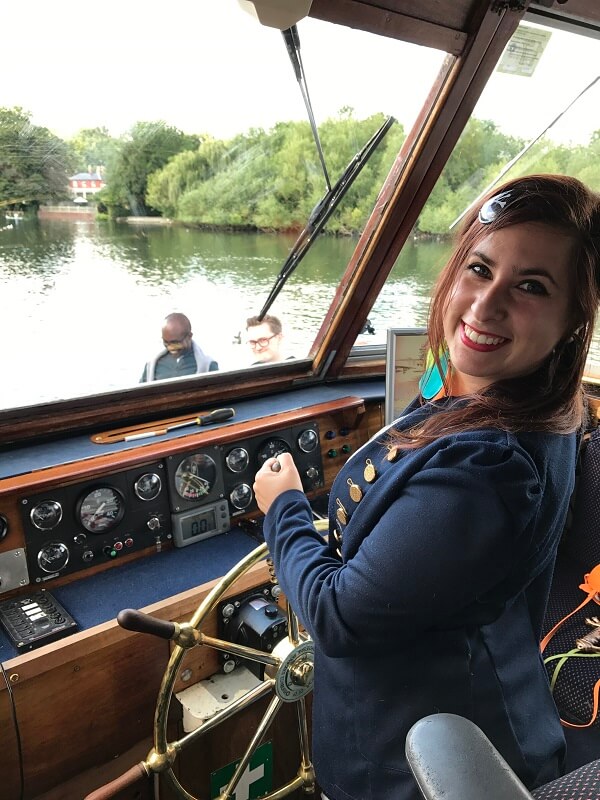 House of Fisher Operations Manager Cristina Lopez Gomez steering the boat!