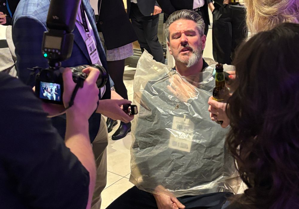 Kearon M. of Staycity having beard shaved for charity